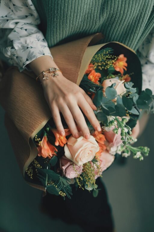 A hand holding bouquet.