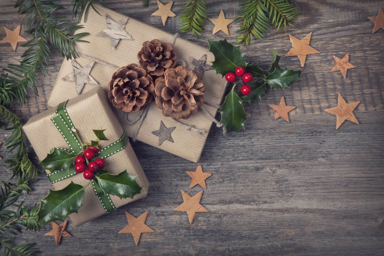 Two wrapped gift box with flowers and stars.